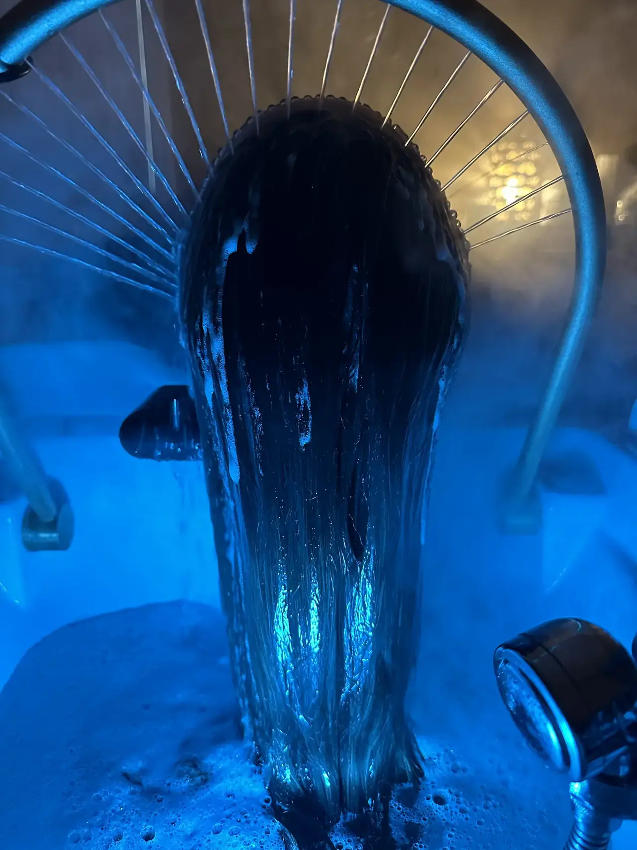 Clinical-grade scalp treatment under blue light therapy at HairPlay Spa