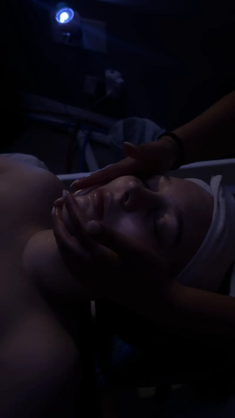 Lymphatic face massage under soft blue light